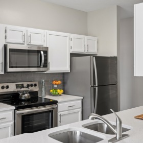 Kitchen with white walls and cabinets 